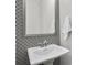 Stylish powder room with decorative mirror and pedestal sink at 635 Broadview Ne Pl, Atlanta, GA 30324