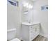 Modern bathroom with a white vanity, framed mirror, and natural light at 2587 Ocean Walk Nw Dr, Atlanta, GA 30318