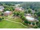 Aerial view of community with pool, gardening plots and common green space at 4143 N Swann St, Covington, GA 30014