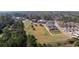 Aerial view of the community showing green spaces, wooded areas and neighboring communities at 4143 N Swann St, Covington, GA 30014