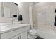 Bathroom featuring white cabinets, a framed mirror, and a shower-tub combo at 4143 N Swann St, Covington, GA 30014