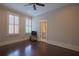 Bedroom featuring hardwood floors, recessed lights, ceiling fan, and ensuite bath at 4143 N Swann St, Covington, GA 30014