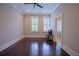 Bedroom featuring hardwood floors, ceiling fan, recessed lighting, and ensuite bath at 4143 N Swann St, Covington, GA 30014