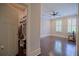 Bedroom featuring hardwood floors and shuttered windows at 4143 N Swann St, Covington, GA 30014