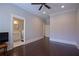 Bedroom featuring hardwood floors, recessed lights, and ensuite bath at 4143 N Swann St, Covington, GA 30014
