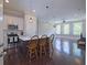 Open-concept living space boasts a modern kitchen island and hardwood flooring perfect for gatherings at 4143 N Swann St, Covington, GA 30014