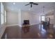 Spacious living room leading to the kitchen, featuring hardwood floors and natural light at 4143 N Swann St, Covington, GA 30014