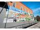 Colorful 'Welcome to Covington' mural on brick building adds local charm at 4143 N Swann St, Covington, GA 30014