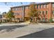 Street view of brick apartment buildings with well-maintained landscaping and trees at 4143 N Swann St, Covington, GA 30014