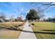 Picturesque town square with benches, mature trees, and historic buildings creates a charming community gathering space at 4143 N Swann St, Covington, GA 30014