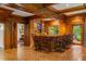 Wood-paneled bar area with seating, custom cabinetry, and views to the outside at 44 Muscogee Nw Ave, Atlanta, GA 30305