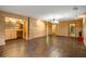 A basement with wood walls, herringbone tile floor, a wet bar, and recessed lighting at 44 Muscogee Nw Ave, Atlanta, GA 30305