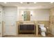 Functional bathroom with a toilet, sink with vanity, and a heated towel rack for comfort at 44 Muscogee Nw Ave, Atlanta, GA 30305