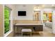 Bright bathroom featuring a large window, vanity with drawers, and a sleek television for convenience at 44 Muscogee Nw Ave, Atlanta, GA 30305