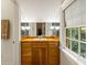 Charming bathroom with a wood vanity, ample natural light, and a view of the outdoors at 44 Muscogee Nw Ave, Atlanta, GA 30305