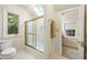 Clean bathroom featuring a tub-shower combo, a skylight, and access to an adjacent room at 44 Muscogee Nw Ave, Atlanta, GA 30305