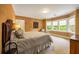 Serene bedroom with a bay window, natural light, and sophisticated decor at 44 Muscogee Nw Ave, Atlanta, GA 30305