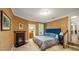 Cozy bedroom with elegant wallpaper, a fireplace, and access to the en-suite bathroom at 44 Muscogee Nw Ave, Atlanta, GA 30305