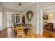 Bright dining area with brick floors, wood table, chairs, and access to the outdoors at 44 Muscogee Nw Ave, Atlanta, GA 30305