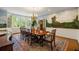 Elegant dining room featuring a large window, scenic mural, chandelier, and a spacious dining table at 44 Muscogee Nw Ave, Atlanta, GA 30305