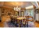 The wood-paneled dining room showcases a large wooden table, a built-in hutch, and an elegant chandelier at 44 Muscogee Nw Ave, Atlanta, GA 30305