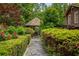 Garden path leading to gazebo surrounded by manicured greenery at 44 Muscogee Nw Ave, Atlanta, GA 30305