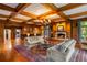 Spacious living room with beamed ceilings, fireplace, comfortable seating, and natural light at 44 Muscogee Nw Ave, Atlanta, GA 30305