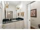 Stylish powder room with dark marble countertop, elegant fixtures, and modern decor at 44 Muscogee Nw Ave, Atlanta, GA 30305