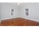 Bright bedroom with wood floors, 2 windows, and neutral walls at 744 Oakland Se Ave, Atlanta, GA 30315