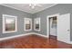 Bright bedroom with wood floors, 2 windows, and an ensuite laundry room at 744 Oakland Se Ave, Atlanta, GA 30315