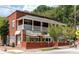 Commercial two-story brick building featuring an outdoor patio space at 744 Oakland Se Ave, Atlanta, GA 30315