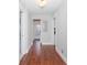 Long hallway with hardwood floors and doors on either side at 744 Oakland Se Ave, Atlanta, GA 30315