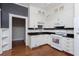 White cabinetry, stainless appliances and black countertops in this classic kitchen at 744 Oakland Se Ave, Atlanta, GA 30315