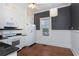 Classic kitchen with stainless appliances, black countertops, and a window for natural light at 744 Oakland Se Ave, Atlanta, GA 30315