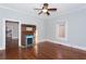 Living room with hardwood floors, vintage fireplace and view to kitchen at 744 Oakland Se Ave, Atlanta, GA 30315