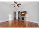 Sunlit living room with wooden floors and classic fireplace at 744 Oakland Se Ave, Atlanta, GA 30315