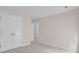 Neutral bedroom with double door closet at 1561 Oak Ivy Ln, Lawrenceville, GA 30043
