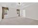 Spacious bedroom featuring tray ceiling and neutral walls and carpet at 1561 Oak Ivy Ln, Lawrenceville, GA 30043