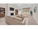 Cozy living room with fireplace, neutral furniture, and plenty of natural light at 1561 Oak Ivy Ln, Lawrenceville, GA 30043