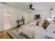 A bright bedroom features a king bed, ceiling fan, and ensuite bathroom at 1860 Mountain Shadow, Stone Mountain, GA 30087