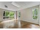 Bright and airy bedroom with large windows offering serene views of the surrounding greenery at 1860 Mountain Shadow, Stone Mountain, GA 30087