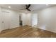 Bedroom with wood floors, multiple entryways, natural light, and minimalist design, creating a versatile space at 1860 Mountain Shadow, Stone Mountain, GA 30087