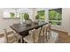 Bright dining room with large windows and a modern table set for six at 1860 Mountain Shadow, Stone Mountain, GA 30087