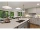 Modern kitchen featuring a large island, skylight and stainless steel appliances with a dining area at 1860 Mountain Shadow, Stone Mountain, GA 30087
