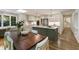 Spacious kitchen features an island, modern appliances, eat-in area, and access to the staircase at 1860 Mountain Shadow, Stone Mountain, GA 30087