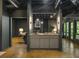 Stylish living room with a gray cabinet and fireplace, with open access to the backyard through glass doors at 1860 Mountain Shadow, Stone Mountain, GA 30087