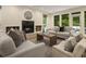 Cozy living room with a fireplace, comfortable seating, and natural light at 1860 Mountain Shadow, Stone Mountain, GA 30087