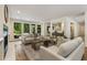 Open-concept living room with a fireplace, natural light, and access to the deck at 1860 Mountain Shadow, Stone Mountain, GA 30087