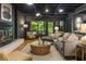 Modern living room with fireplace, comfortable seating, and large windows offering beautiful views at 1860 Mountain Shadow, Stone Mountain, GA 30087