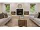 Comfortable living room with a fireplace and serene view of the surrounding trees at 1860 Mountain Shadow, Stone Mountain, GA 30087